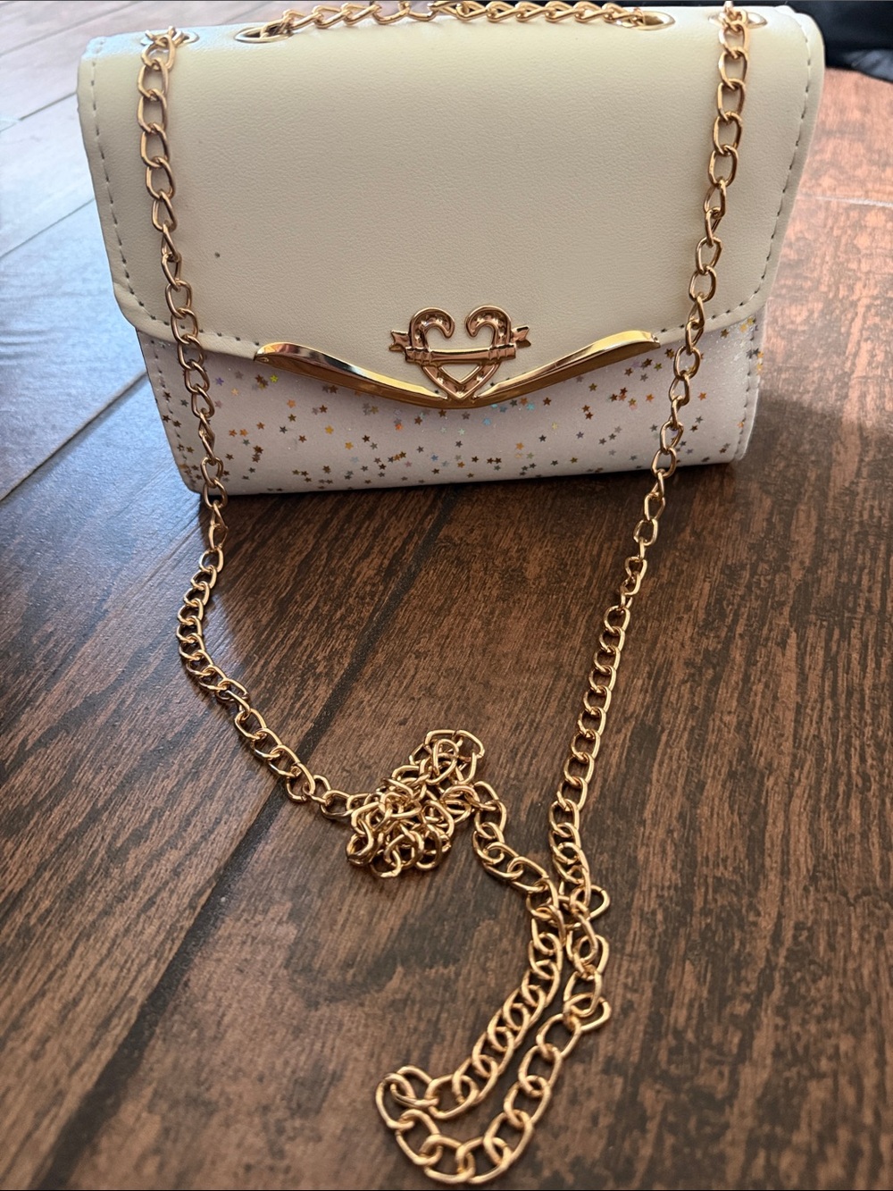 Elegant Cream Crossbody Bag with Gold Chain and Star Details